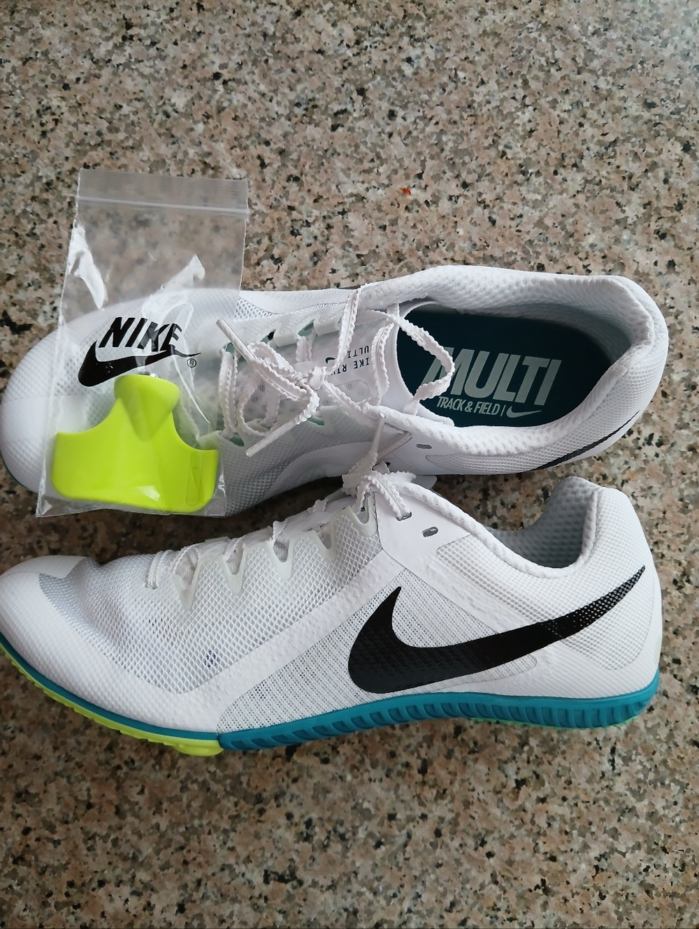 Men's Nike White Track Spikes with Black Swoosh and Blue Sole